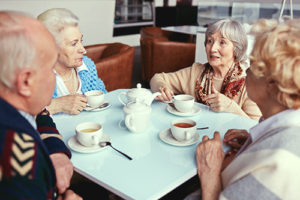Happy seniors having tea